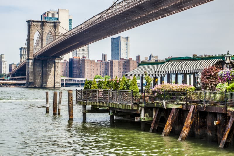 Amazing panorama view of New York City restaurant and Brooklyn bridge in New York, the culinary capital of the USA