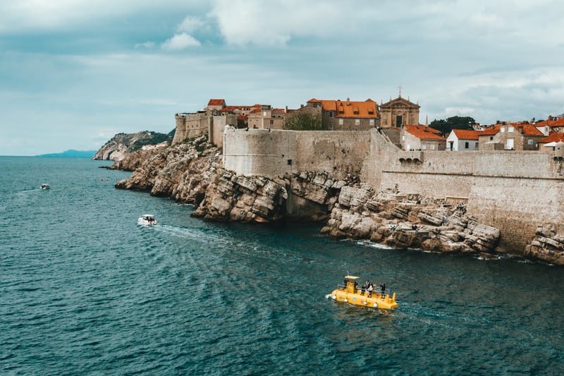 Travel the wold by cruise to see historic coastal towns with walled cities by sea 