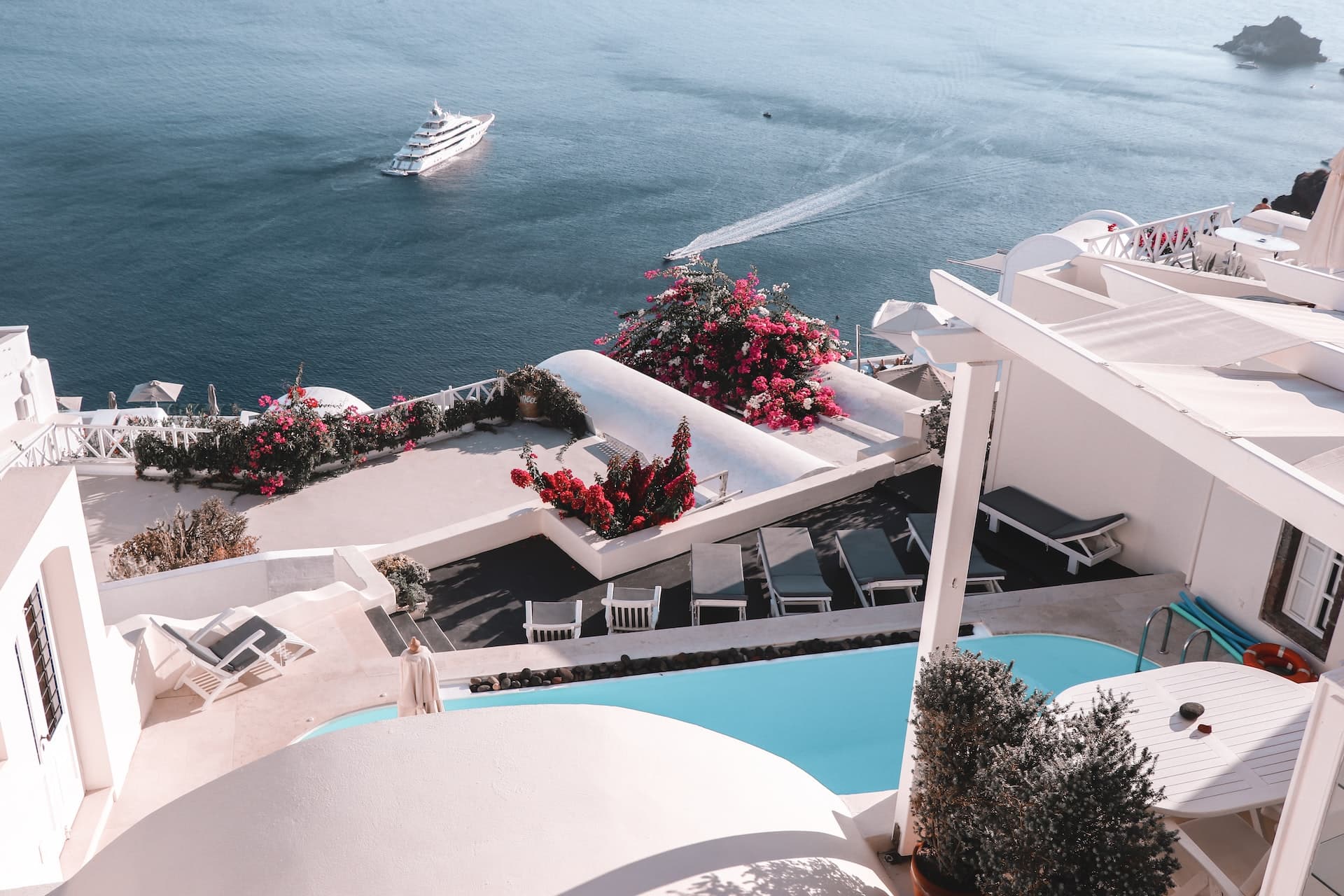 Popular shared ownership choices: Greek Island holiday homes with superyacht in the bay