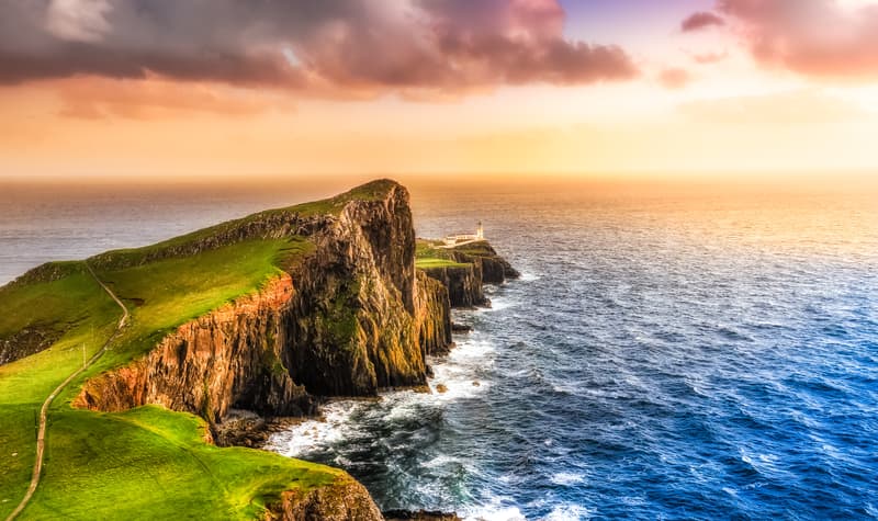 Rugged cliff headland and lighthouse in theScottish Isles