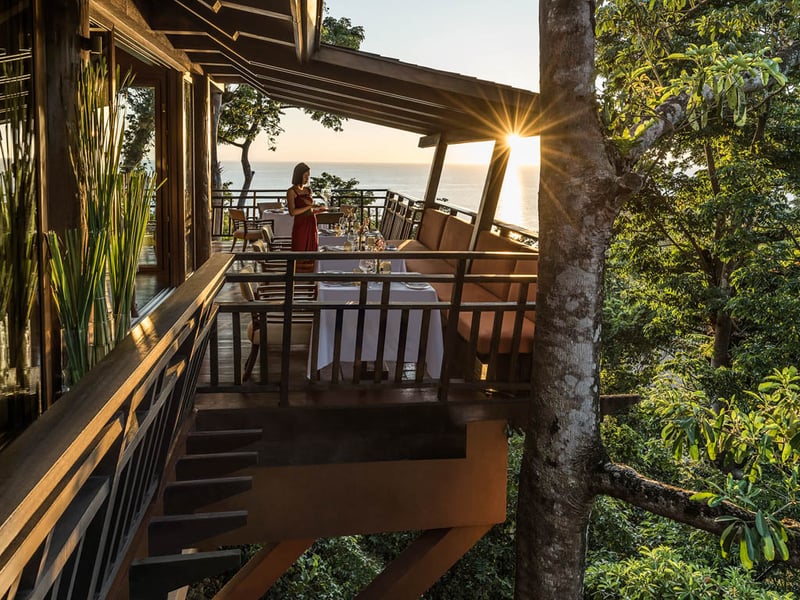 Girl setting up table in Shangri-La Boracay Treehouse, Philippines