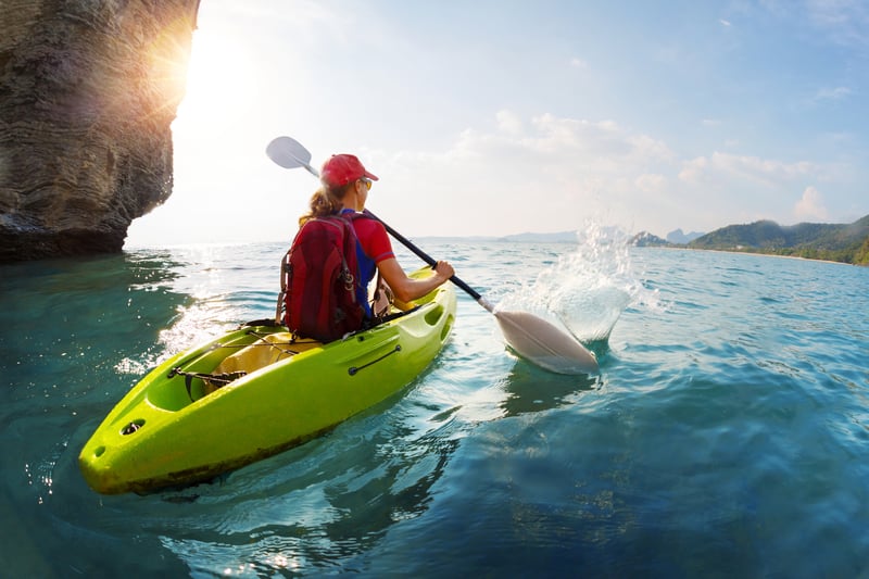 Paddling a kayak on a sunny day