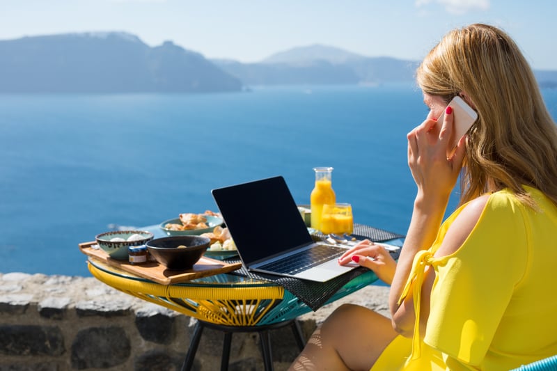 Expat working while on vacation in Mediterranean