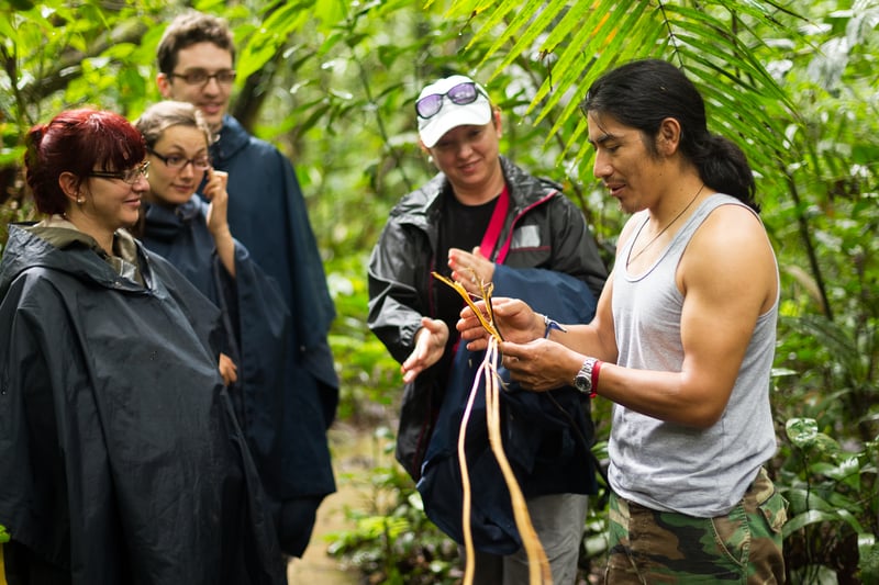 Tourists on a local guided tour supporting the local community In Amazonia
