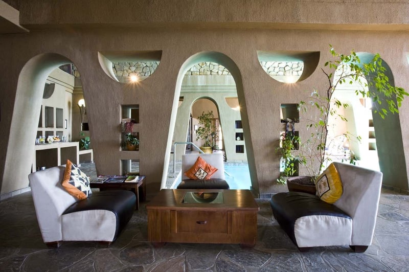 A lounge and pool in a stylish wellness center offering longevity services